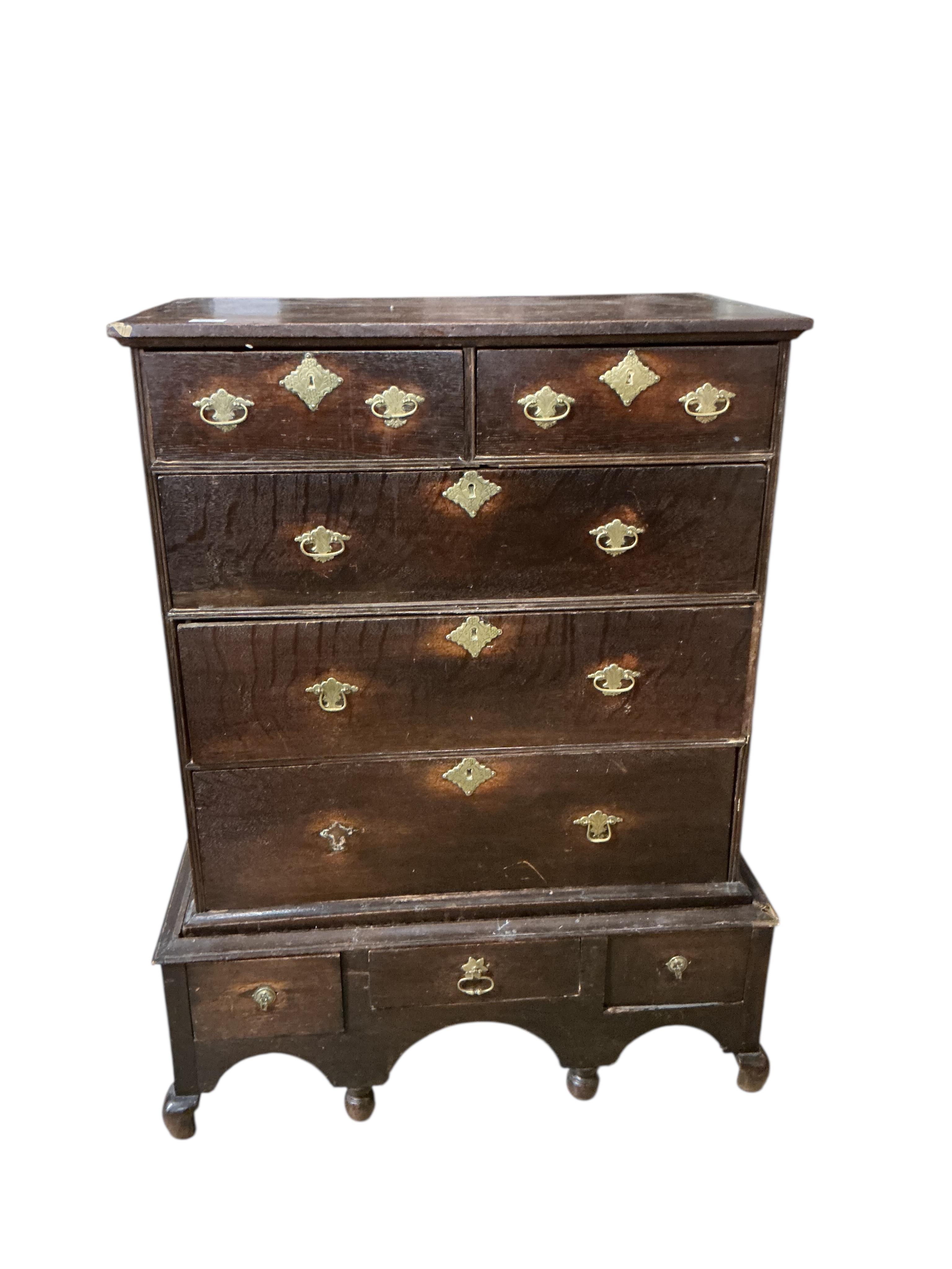 A William and Mary oak chest on stand, cut down base, width 90cm, depth 52cm, height 117cm